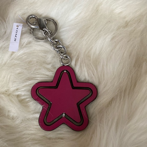 SPINNING STAR BAG CHARM IN SIGNATURE CANVAS - Picture 1 of 6